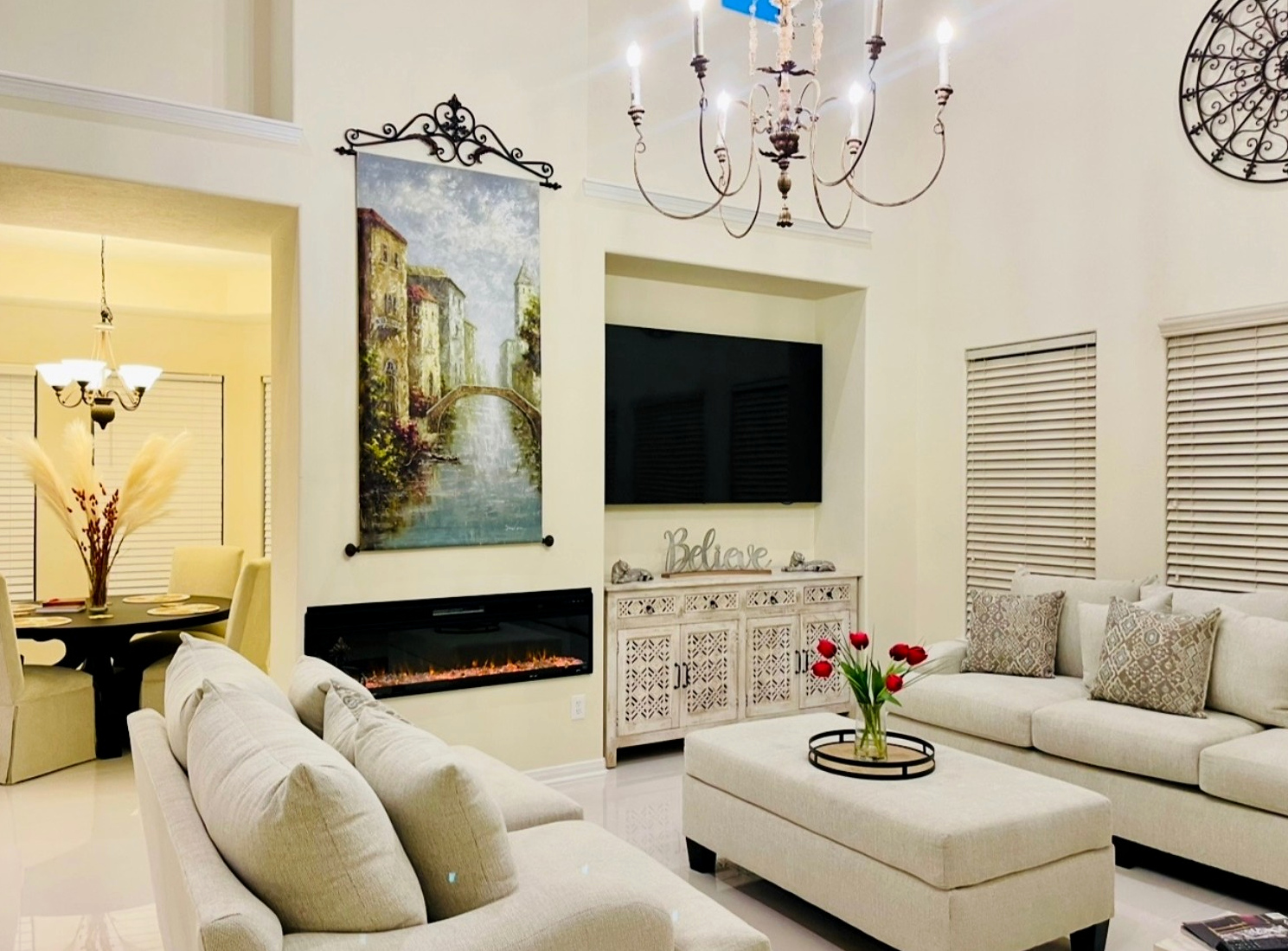 Completed living room with linear fireplace, television alcove, and coordinated finishes